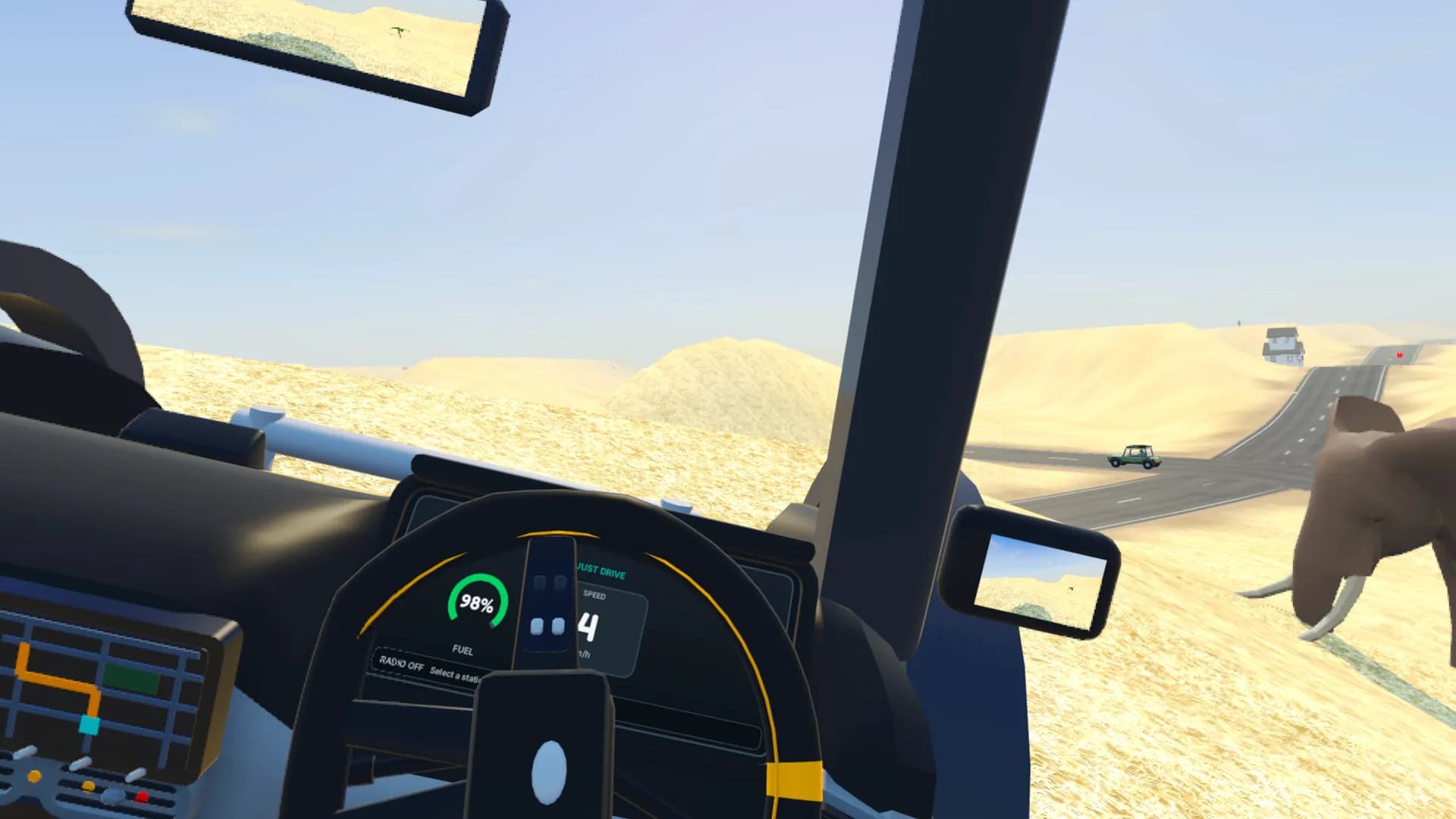 Driving past an elephant on a desert road between sand dunes